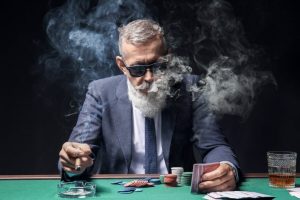 Man smoking at casino table